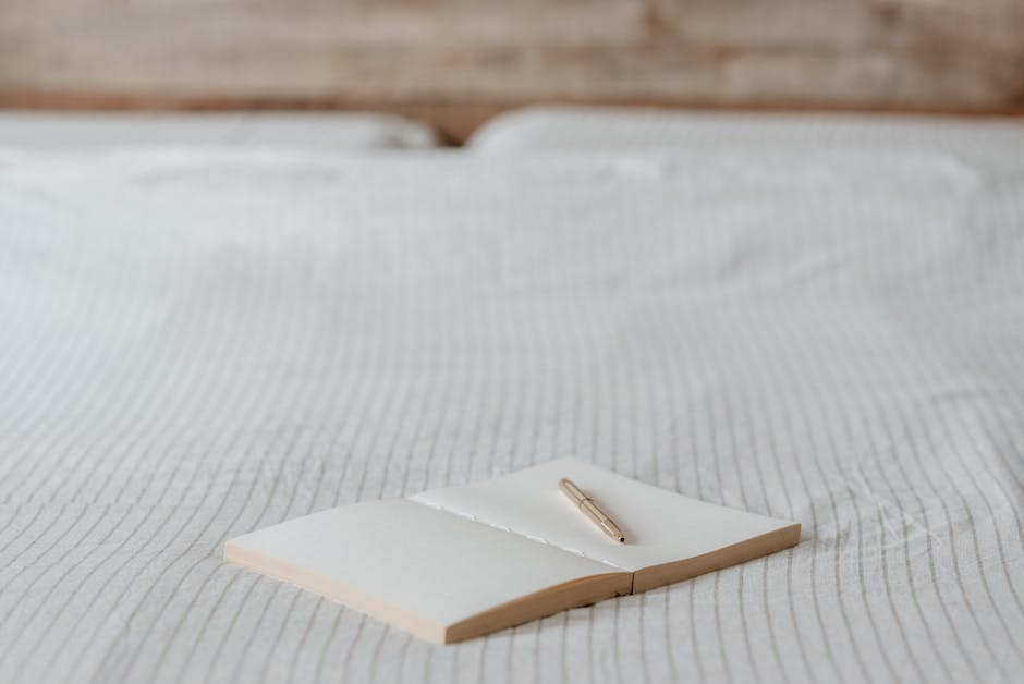 A handwritten letter on a wooden table with a pen and a broken chain symbolizing a letter of apology explaining reasons for resignation.